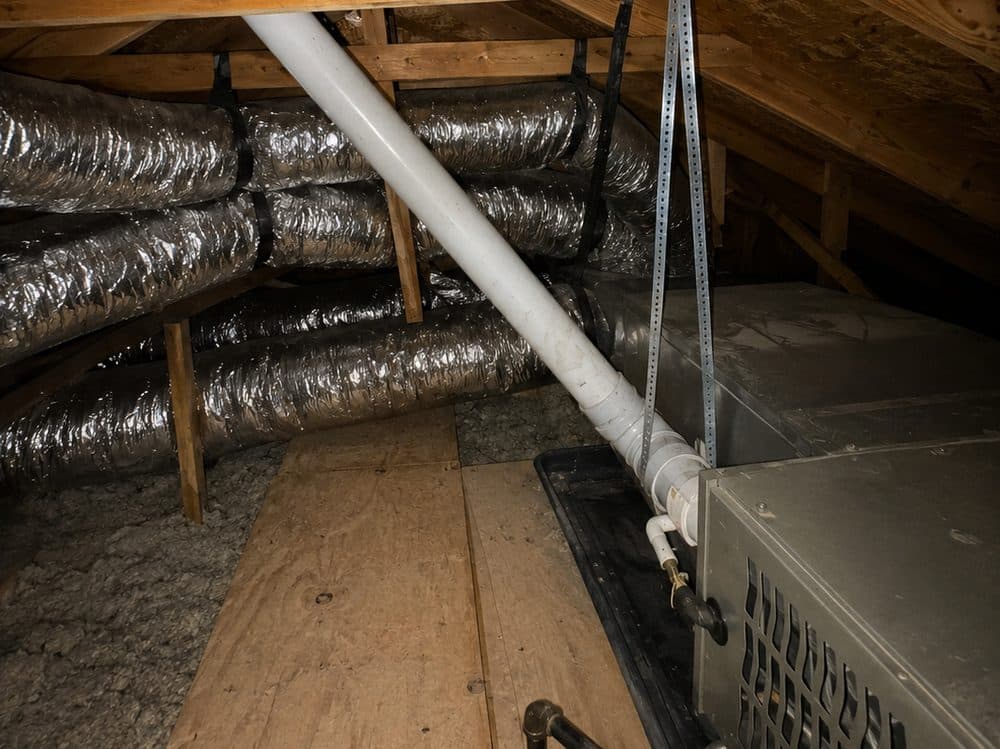 Flexible insulated air ducts and the air handler in a residential attic